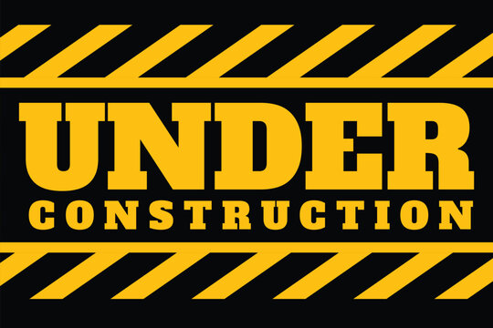 Under construction warning sign text with yellow black stripes painted over concrete wall cement facade background. 