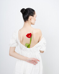 Sexy girl with a tulip flower. Visual that can be used in e-commerce, online sales and social media. womanhood concept