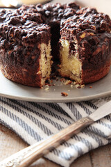 Delicious chocolate coffee cake on table