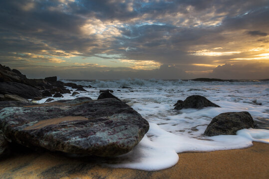A beautiful sunset in the rocky beaches of Kerala