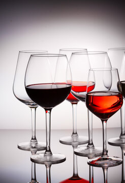 Set of party hight wine glasses with red, white and rose wine close up