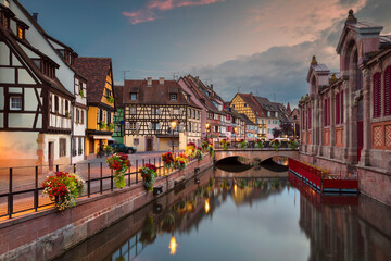 Cityscape image of downtown Colmar, France during sunset.
