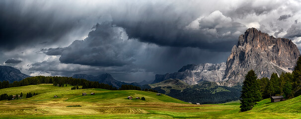 storm over the mountains Dolomiti in the summer season with green meadow illuminated of the Sun