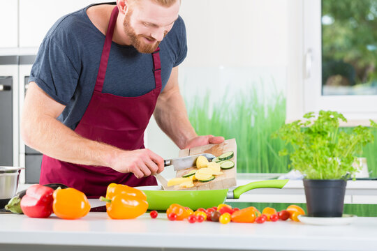 Man preparing very healthy organic food for cooking in kitchen