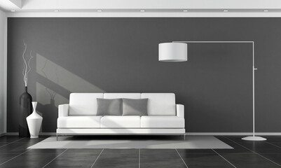 White sofa in a black minimalist living room - 3d rendering