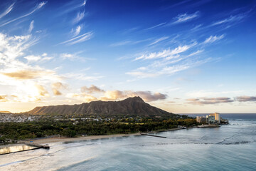Sunrise panoramic view of the densest parts of Honolulu at Waikiki and its beach and hotels and Diamond Head