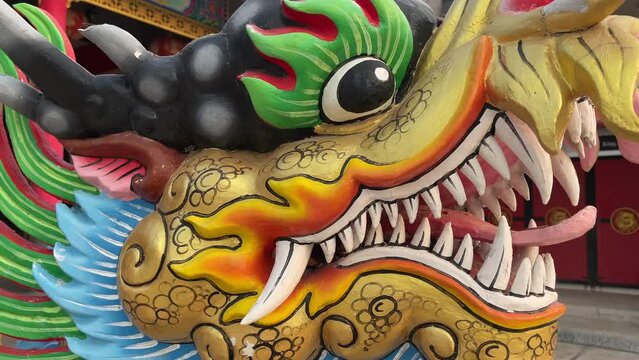 Golden dragon head at the entrance to the Chinese temple, Pattaya, Thailand