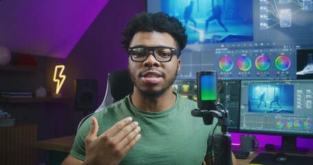 African American colorist speaks on camera with microphone, records educational video training...