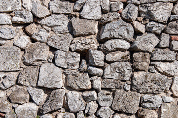 Rough grey stone wall background