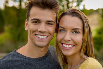 Fototapeta premium Portrait of a young beautiful couple smiling