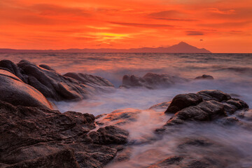 Vourvourou - Karidi beach with mount Athos in the background surprised at sunrise.