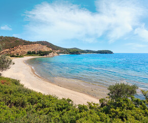 Fototapeta na wymiar Summer Aegean Sea coast landscape with sandy beach and wild camping (Sithonia, Halkidiki, Greece).