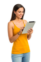 Fototapeta premium Beautiful and happy young woman working with a tablet