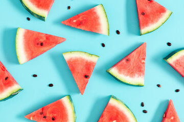 Watermelon pattern. Red watermelon on blue background. Summer concept. Flat lay, top view, copy space