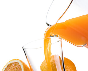 Pouring refreshing natural orange juice into a glass: nutrition and healthy drinks