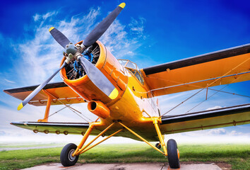 biplane against a claudy sky