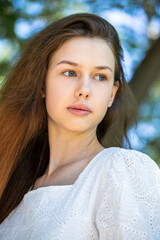 Portrait of a young tenager girl, summer park outdoors