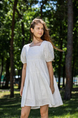 Portrait of a young tenager girl, summer park outdoors