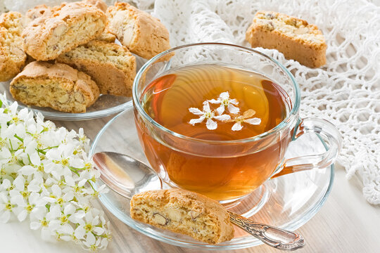 Transparent cup herbal tea and homemade cantuccini cookies