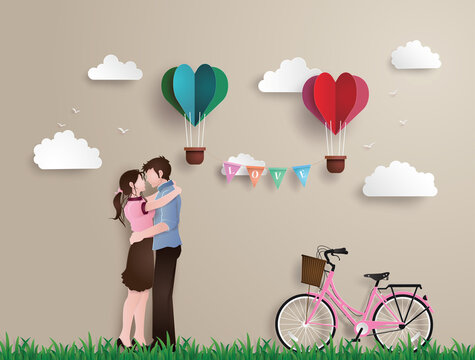 Illustration of love and valentine's Day,  with couple standing hugging on a grass field with pink bicycle and heart shaped balloon.paper art and origami style.