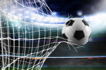 Ball scores a goal on the net in a football match