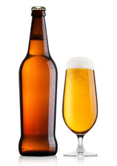 Cold bottle and glass of lager beer with foam and dew isolated on white background