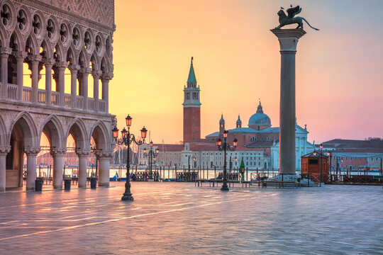 Cityscape image of St. Mark's square in Venice during sunrise.