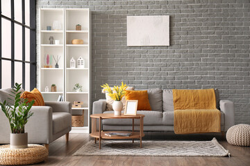 Interior of modern living room with sofas, coffee table and shelving unit