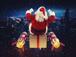 Santa Claus with gift box flies with rockets on space