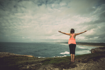 Obraz premium Beautiful young woman enjoying the freedom