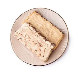 Plate with pieces of tasty marble halva on white background