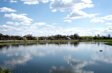 A lake with reflective clouds in the water. Selective focus