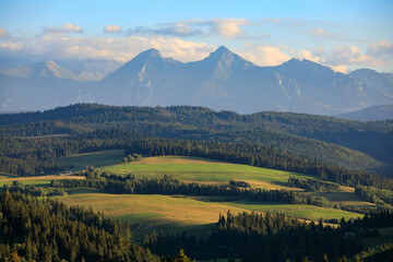 Spisz region: Green Meadows on the hills in front of Tatra mountains