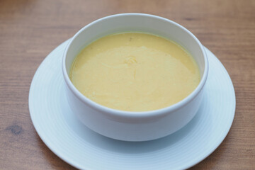 Thai hot spicy soup in bowl on table 