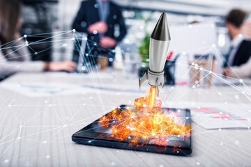 Fast rocket ready to starts from a tablet. concept of company startup