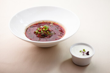 Beetroot soup with meat and sourcream served in restaurant