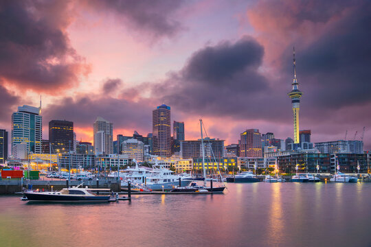 Cityscape image of Auckland skyline, New Zealand during sunrise.