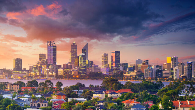 Panoramic aerial cityscape image of Perth skyline, Australia during dramatic sunset.