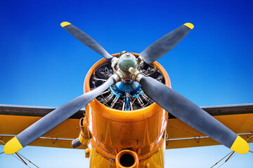 propeller of an historic airplane against a blue sky