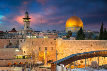 Naklejka premium Cityscape image of Jerusalem, Israel with Dome of the Rock and Western Wall at sunset.