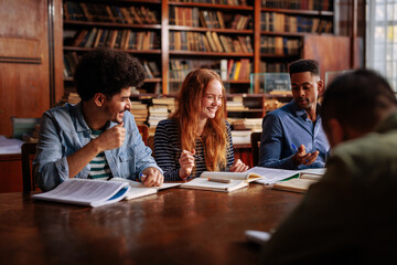 Group of students study in library.