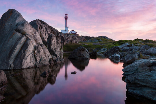 Cape Forchu Lighthouse at sunrise. Nova Scotia, Canada.
