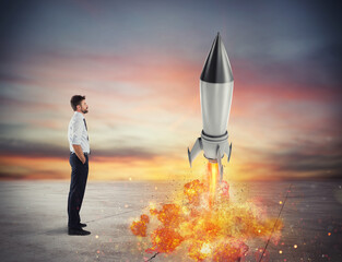 Startup of a new company of a businessman with starting rocket. Concept of business growth