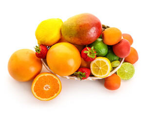Wicker bowl with different fresh fruits on white background