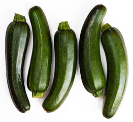 Five pieces of green zucchini (zucchetti, courgettes) on a white background