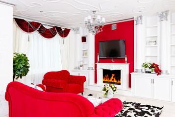 Classical red living room interior space with fire place and red furniture