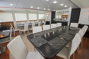 Interior design furnishing decor of the salon dining area in a large luxury motor yacht
