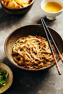 Freshly cooked soba noodles in a bowl. Asian cuisine meal.