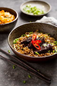 Soba noodles with beef and hot pepper. Buckwheat Noodle.