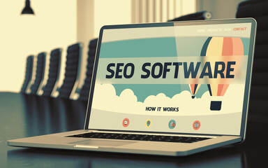 SEO Software Concept. Closeup Landing Page on Mobile Computer Screen on Background of Conference Hall in Modern Office. Blurred Image with Selective focus. 3D.